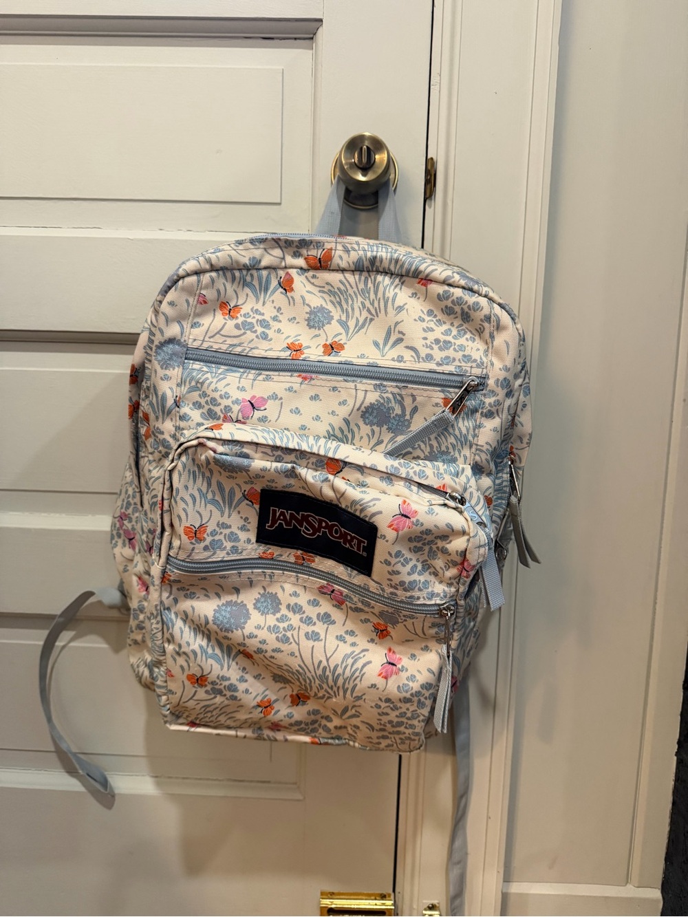 JanSport Cream Backpack with Blue and Orange Floral Print